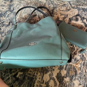 Women’s coach handbag and matching wallet. Teal blue color.